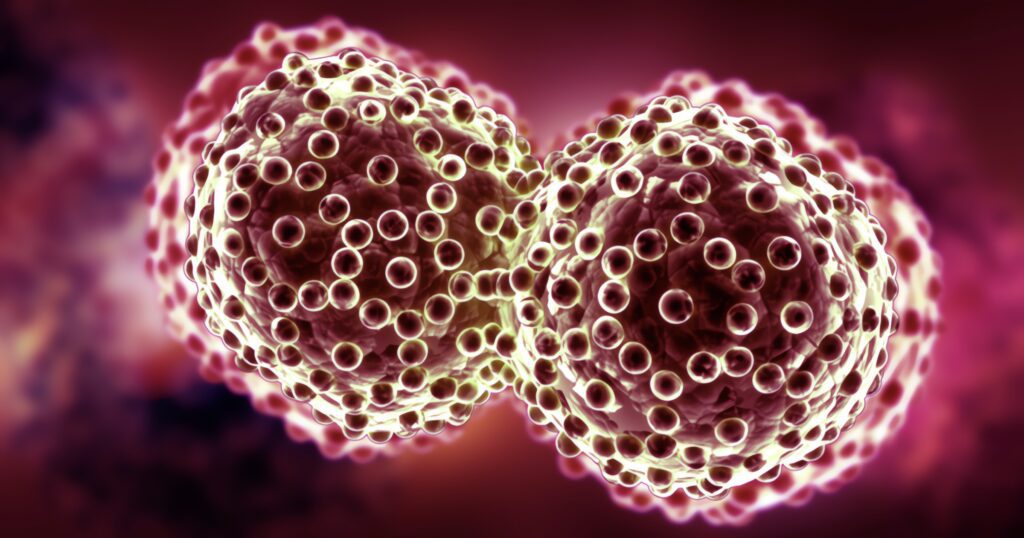 two cancer cells undergoing rapid division.